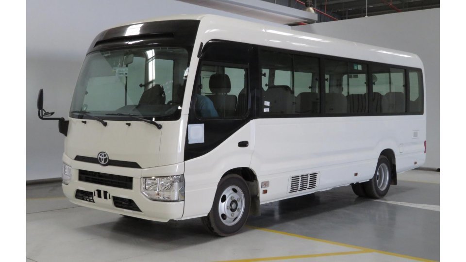 Buy import toyota coaster white car in import dubai in atlantida